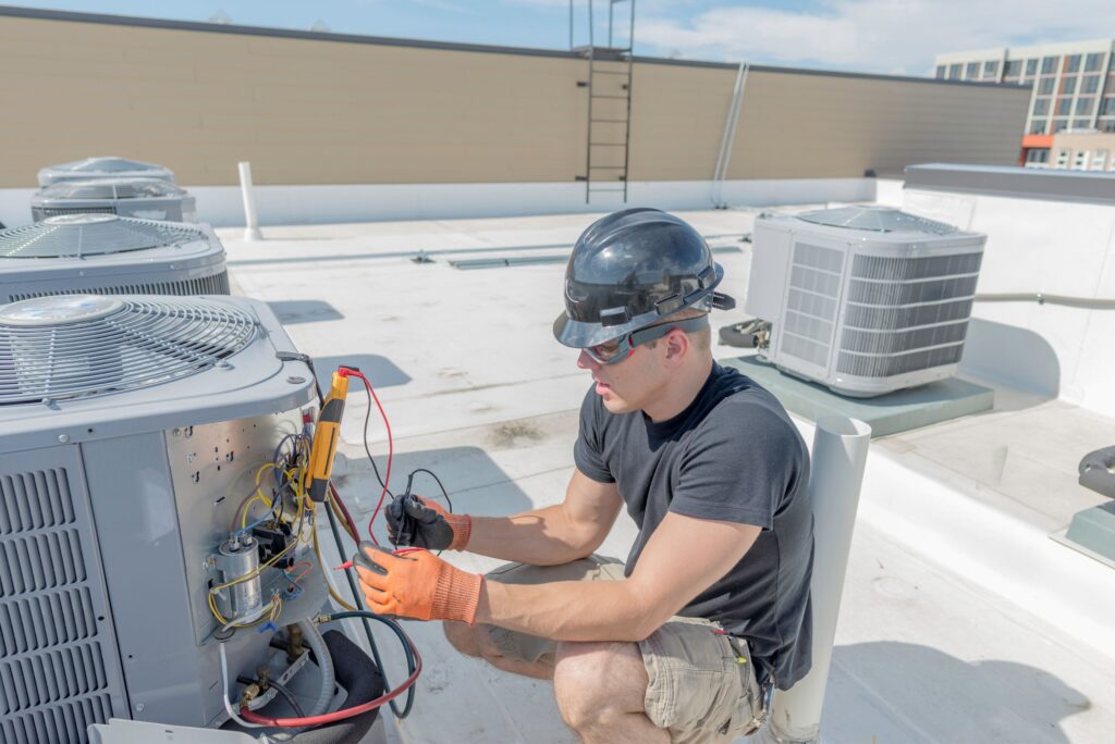 emergency hvac technician repairing unit