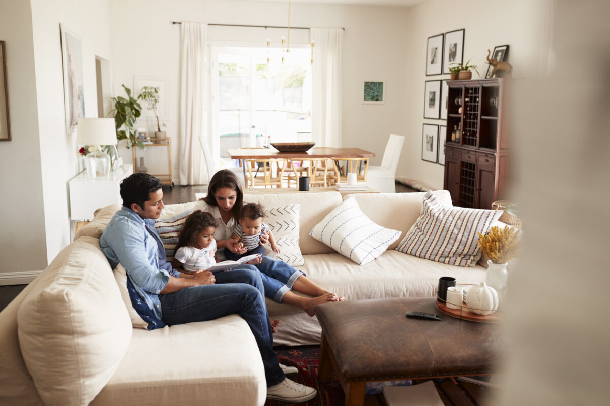family with young kids relaxing in cozy living room