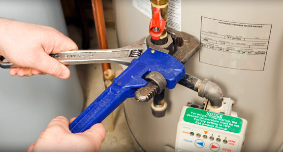water heater being serviced by technician